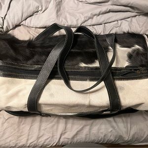 Brand new overnight bag. Black and white cowhide.